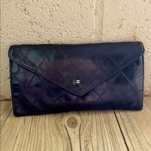 Authentic CHANEL black quilted cambon clutch bag